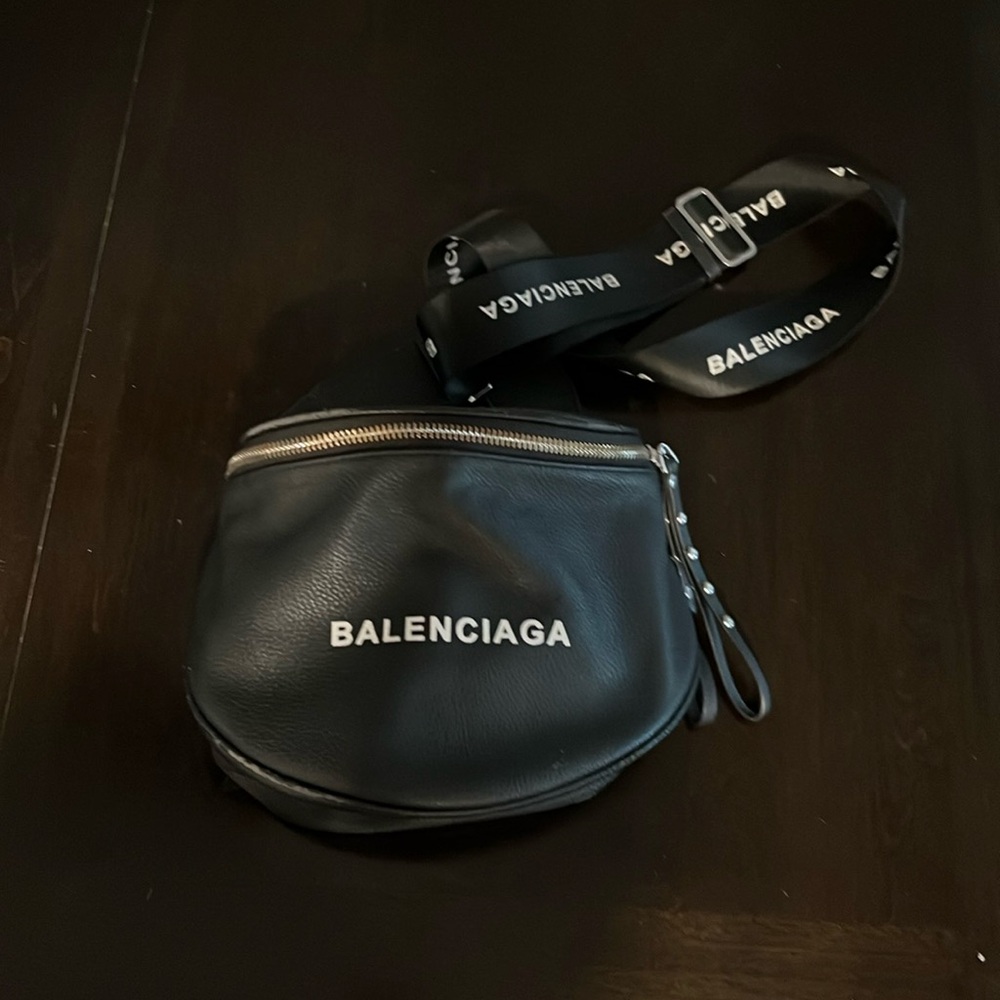 Sling bag with detachable and adjustable strap